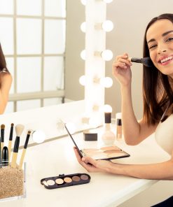 Model with Gold Makeup Brush Holder