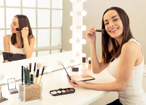 Model with Gold Makeup Brush Holder